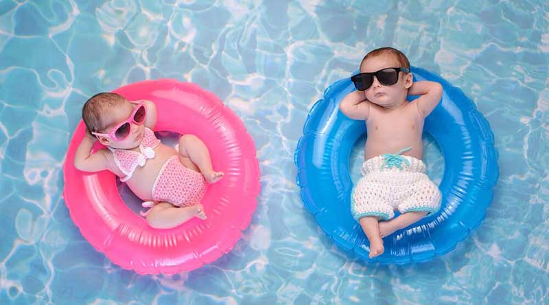 Babys on the pool taking sun