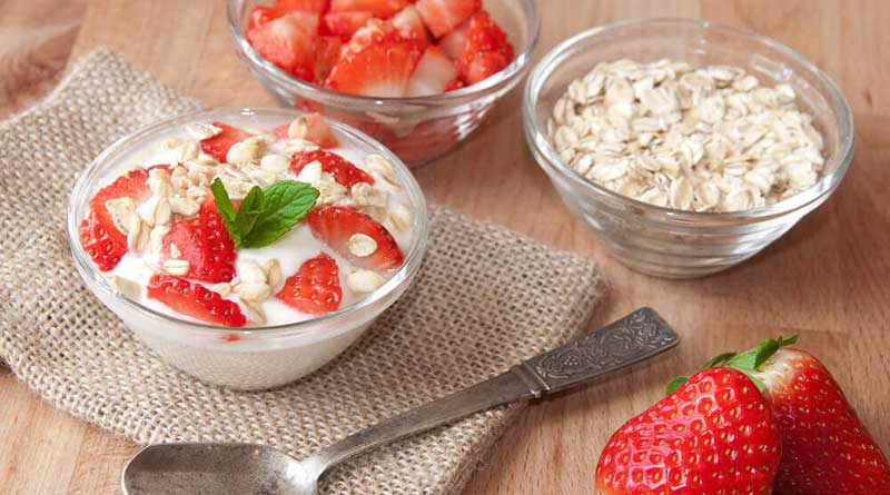 Breakfast with oatmeal and natural yogurt